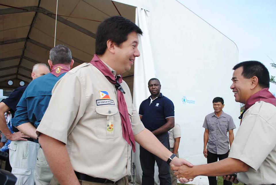 Tacloban City Mayor Alfred Romualdez (left) shakes hand, in boy’s scout way, Leyte Governor Leopoldo Petilla. The two welcome King Carl XVI Gustaf of Sweden during his visit to Tacloban on January 26. (Photo by: TOOTSIE CINCO MAYE)