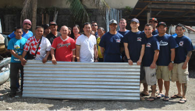 Members of the “Los Bomberos” of the San Jose Fire “Station in Sa Jose, California, USA donates corrugated sheets to victims of supertyphoon Yolanda. Also in photo is An Waray party-list Rep. Neil Benedict Montejo. (LITO A. BAGUNAS)  