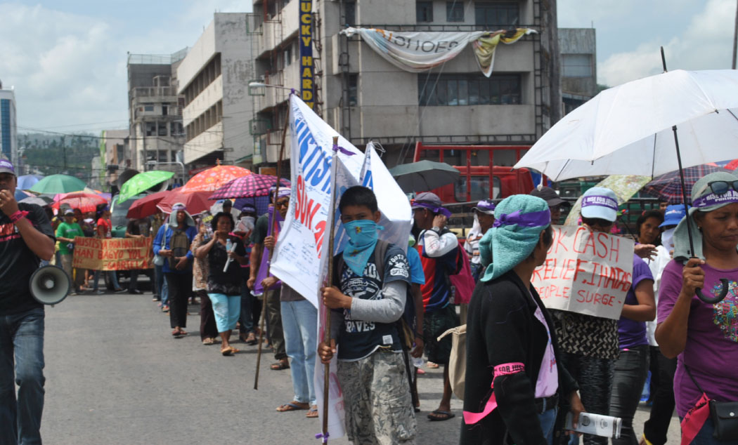 Members of different groups staged their rally in downtown Tacloban as they pressed on their demands for a continued food and cash assistance from the national government. (LITO A. BAGUNAS)