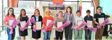“Glimmers of Hope” awardees and representatives pose for a posterity photo with PIA Regional Director Olive Tiu during the Harampang ha PIA held April 10 in Tacloban City.(by Ei Nazareno-Ballesteros)   