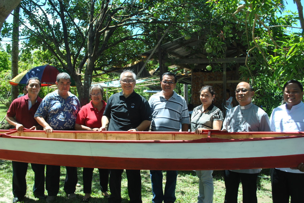 Fishermen from different towns of Leyte received their new fishing boats from the Marriage Encounter of the Philippines,Inc. headed by former presidential economic adviser Robert Aventajado in a simple turn-over rite in Babatngon, Leyte last May 13,2013. (LITO A. BAGUNAS & Toots Maye)