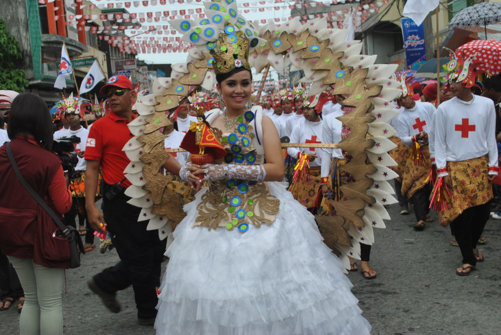 A member of a contingent of the Sangyaw Festival hold dearly an image of Senior Santo Niño, during the Sangyaw Festival on June 29.Typhoon survivors believed that they survived Yolanda’s fury due to the intervention of the Child Jesus.(LITO A. BAGUNAS)
