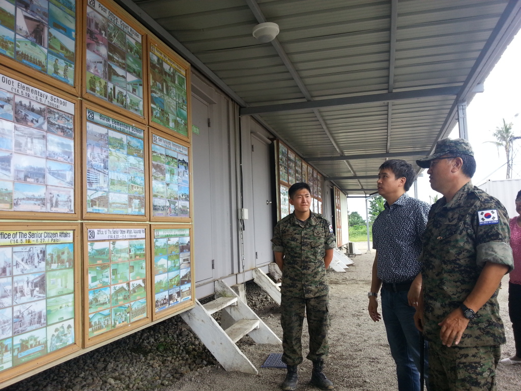 Colonel Chulwon Lee, commander of Araw Force, a military humanitarian contingent from South Korea helping in the recovery and rehabilitation effort in areas affected by typhoon Yolanda in the region briefed TESDA Secretary General Emmanuel Joel Villanueva (center)of their accomplishments on the repair of public infrastructures since they arrived in Leyte last December,2013.