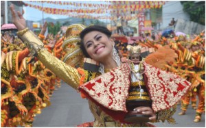 Today thousands of devotees will pay their homage to Senior Santo Niño, patron of Tacloban which celebrates its 126th annual fiesta today. Photo shows a dancer from the Buyugan Festival of Abuyog town in Leyte, prominently holds the image of Senior Santo Niño during a street parade in this year’s Pintados-Kasadyaan Festival of Festivals.(LITO A. BAGUNAS)