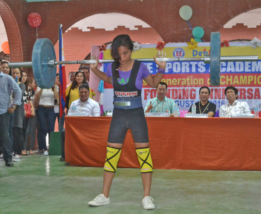 Leyte Sport Academy (LSA)  scholar Veronica Ompod, 15 year old of Matag-ob Leyte, who won a gold medal at the World Classic Power Lifting Championship last June this year demonstrates before her audience during the 6th LSA anniversary how she won the gold medal at the World Classic Power Lifting Championship. (Photo by: Restituto A. Cayubit)