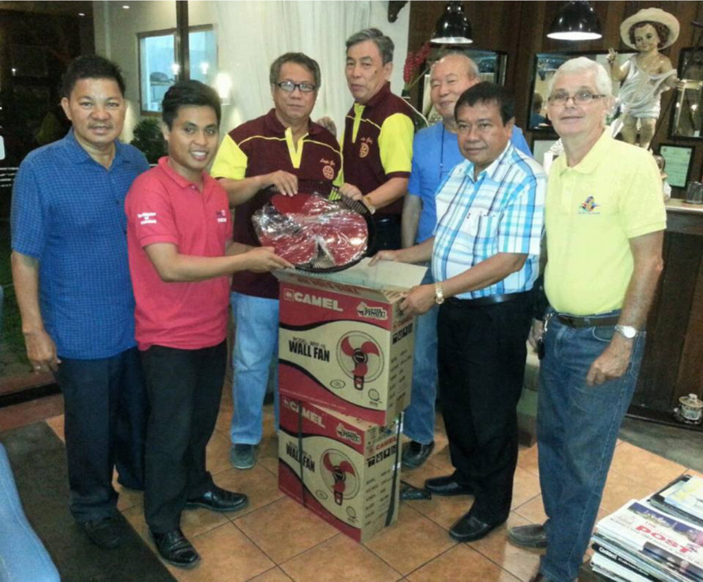 President Dalmacio “Massey” Grafil and members of RC Leyte Gulf turn over to Capiran Elementary School principal Gerald Dacillo two wall electric fans to be install in the kindergarten room of his school. Also in photo are Jose Clarin and Humberto Franco.