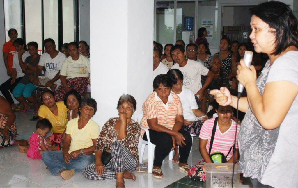 Its been three years after they lost their houses due to supertyphoon ‘Yolanda,” 244 families living in areas declared as ‘no build zone’ by the municipal government of Giporlos, Eastern Samar have yet to be relocated. Photo shows  Rina Reyes,project manager of Katarungan-EV hold a dialogue Thursday to find solution on their predicament.(MEL CASPE)