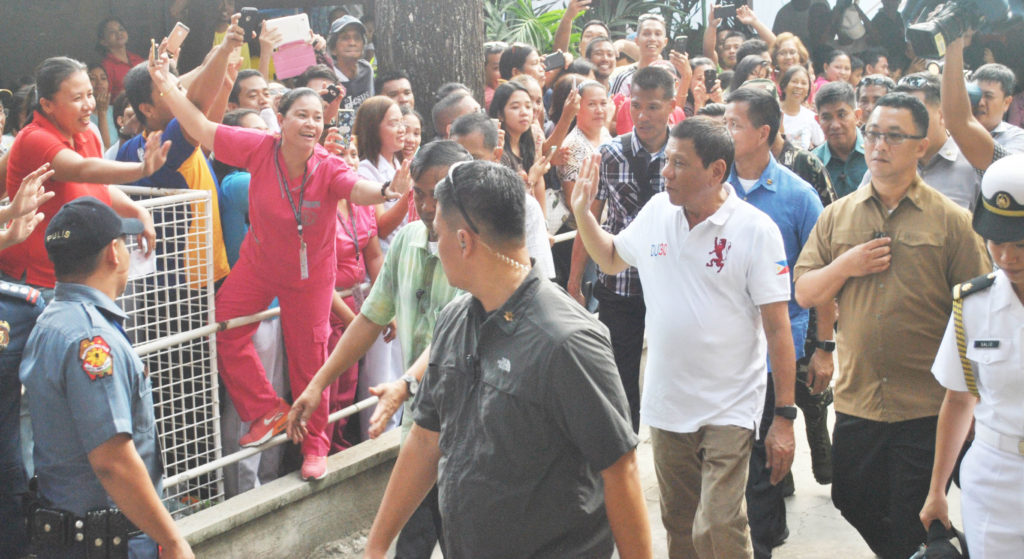 WELCOME FIT FOR A ROCKSTAR. President Rodrigo Duterte was in Tacloban City on Monday(August 29) to visit a wounded police officer at the Divine Word University Hospital. The President was mobbed like a rockstar by his supporters.   (LITO A. BAGUNAS)     