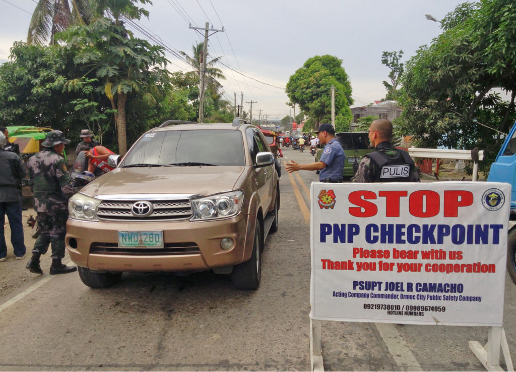 Checkpoints have been established across the country after President Rodrigo Duterte placed the entire Philippines under state of emergency on account of lawlessness violence on Sept.2. Photo shows police manning a checkpoint in Ormoc City.(LITO A. BAGUNAS) 