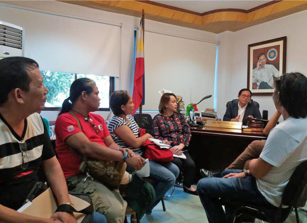 Tacloban City Vice Mayor Jerry “Sambo” Yaokasin and Councilor Aimee Grafil assure the families living in coastal areas in the city that they will not be relocated without proper notice and if the relocation sites are not completed. The two city officials made the assurance during a meeting on Nov.16 after 500 people staged a protest to dramatize their opposition to this reported plan of transfer before the year ends . (JAZMIN BONIFACIO) 