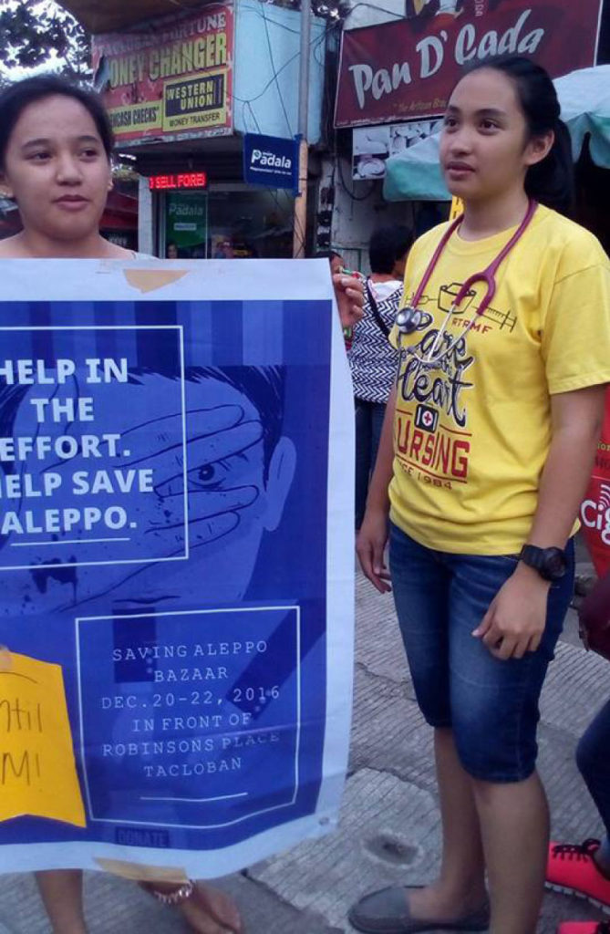 Friends Frances Anido (right) and Raven Bolino sold used clothings, popularly known as “ukay-ukay” they collected from their friends, family members and from their own closets, to sell and raise funds intended for the victims of civil war in Aleppo, Syria. (JOEY A. GABIETA)