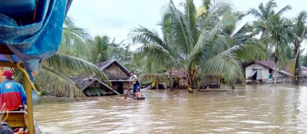 WATER WORLD. Incessant rains dumped by “tail of the cold front” inundated the three Samar provinces which displaced tens of thousands of families, drowning of people, and landslides. Photo shows a part of Dolores, Eastern Samar, experiencing massive flooding that reached up to six meters in height. (PHOTO COURTESY:PHILIPPINE INFORMATION AGENCY-8)