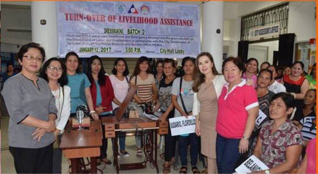 Fifty women from the different barangays of Tacloban City received sewing machines from the city government to serve as their source of income. With them were Tacloban City Mayor Cristina Romualdez, Councilor Evangeline Esperas(extreme right) and PESO Mely Cruz (left).